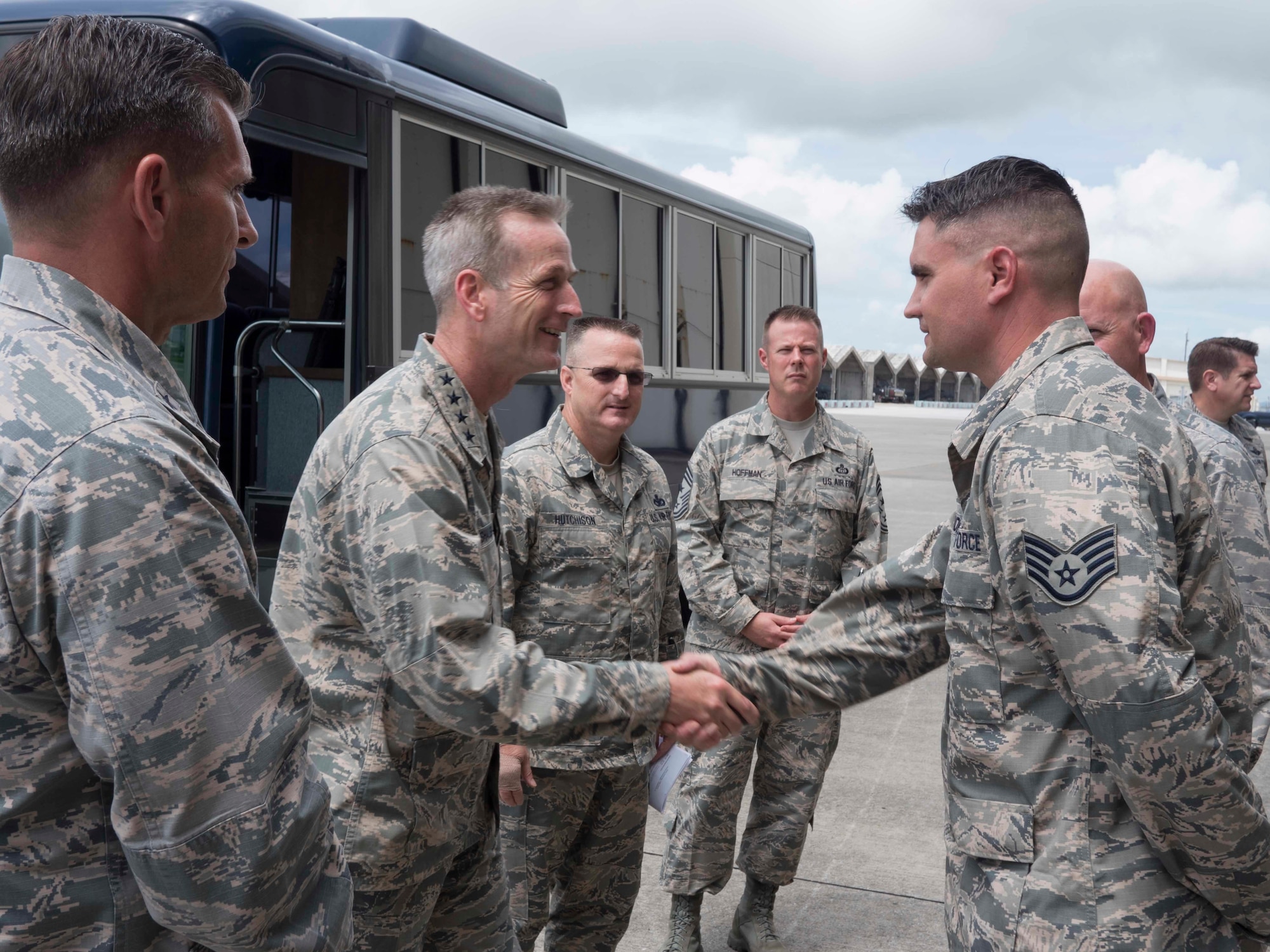 U.S. Air Force Gen. Terrence J. O’Shaughnessy, Pacific Air Forces commander, coins U.S. Staff Sgt. Daniel Tondre, 18th Munitions Squadron assistant noncommissioned officer in charge, for his hard work and dedication to his job at Kadena Air Base, Japan, Aug. 11, 2016. During his visit to the base, the general presented coins to several Airmen from Kadena in honor of their outstanding performance and dedication to the mission. (U.S. Air Force photo by Senior Airman Omari Bernard)