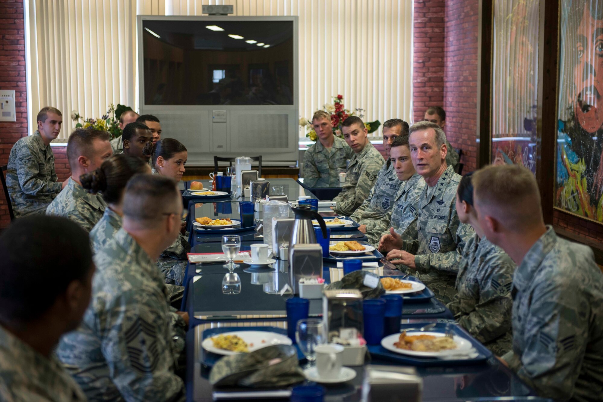 U.S. Air Force Gen. Terrence J. O’Shaughnessy, Pacific Air Forces commander, responds to questions from junior enlisted Airmen during his visit to Kadena Air Base, Japan, Aug. 11, 2016. During his visit, the general stressed the role each Airman plays in the mission and asked what he could do to improve their mission capabilities. (U.S. Air Force photo by Senior Airman Omari Bernard)
