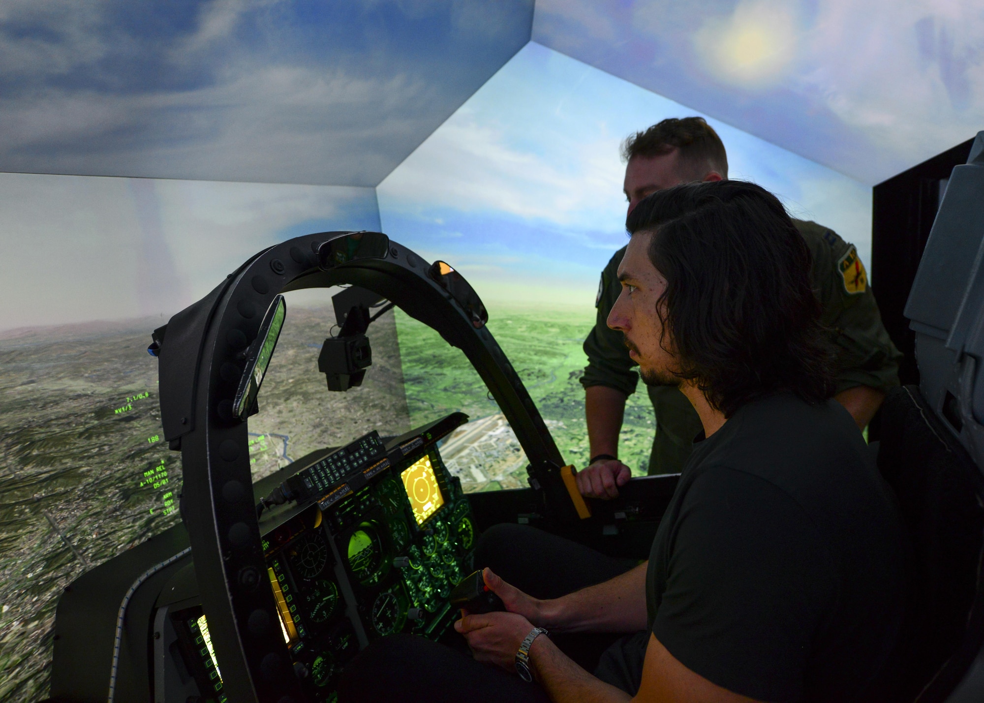 Actor Adam Driver operates the A-10 Thunderbolt II flight simulator at Osan Air Base, Republic of Korea, Aug. 13, 2016. Driver visited base to perform a reading of the play “Lobby Hero” alongside several other actors, and was given insight to the importance of the Team Osan mission. (U.S. Air Force phot by Senior Airman Victor J. Caputo/Released)
