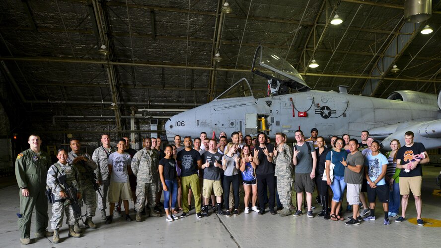 Members of Team Osan pose with the actors and crew members of “Lobby Hero” in front of an A-10 Thunderbolt II during a visit to Osan Air Base, Republic of Korea, Aug. 13, 2016. The cast and crew visited a maintenance hangar and the A-10 flight simulator prior to the play to gain an understanding of the Team Osan mission. (U.S. Air Force photo by Senior Airman Victor J. Caputo/Released)