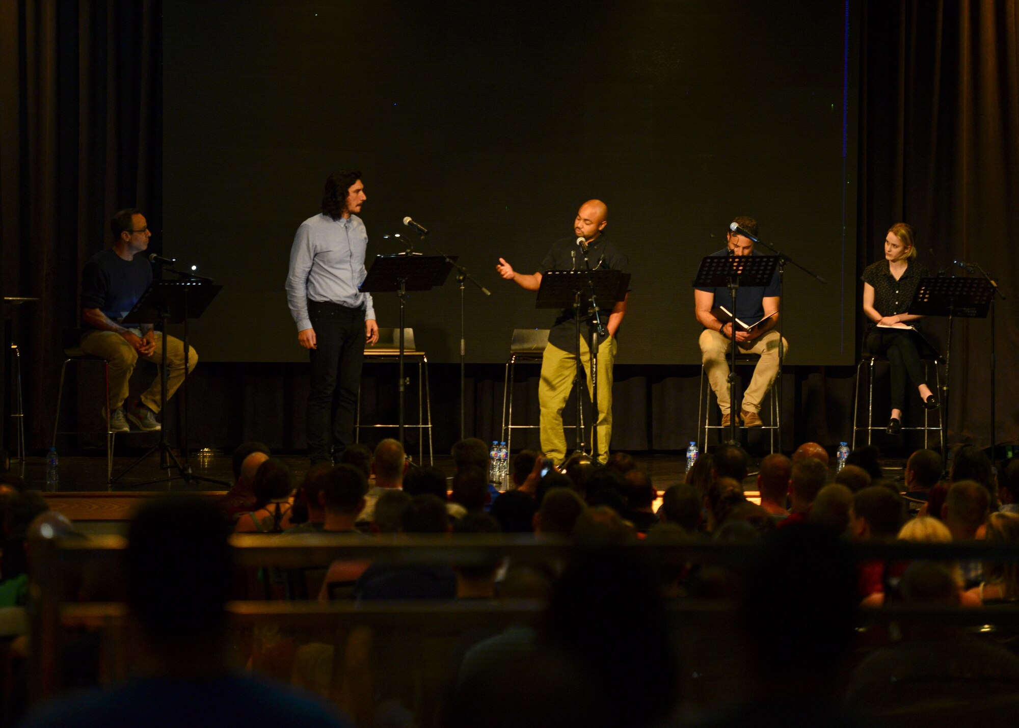 Director Stephen Belber, and actors Adam Driver, Francois Battiste, Dominic Fumusa, and Rachel Brosnahan perform a reading of the play “Lobby Hero” in the Enlisted Club at Osan Air Base, Republic of Korea, Aug. 13, 2016. The play reading was sponsored by Arts in the Armed Forces, a non-profit organization founded by Driver to bring free theater performances to military members. (U.S. Air Force photo by Senior Airman Victor J. Caputo/Released)