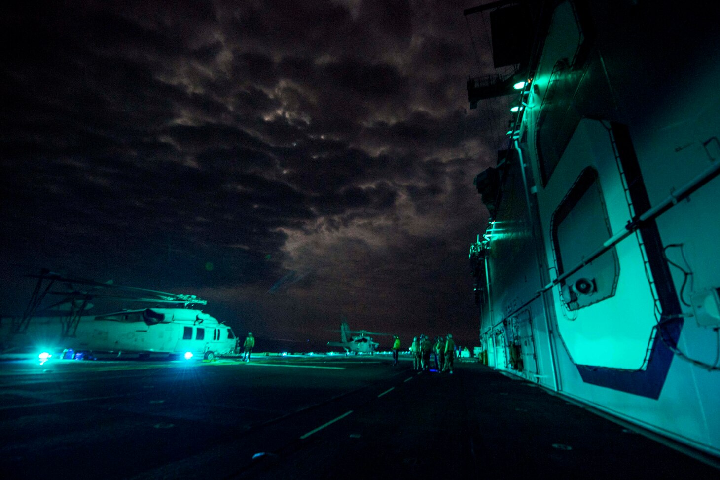 Navy sailors conduct flight operations with MH-60S Sea Hawks assigned to Helicopter Sea Combat Squadron 25 aboard amphibious assault ship USS Bonhomme Richard in the East China Sea, Aug. 12, 2016. The Bonhomme Richard, flagship of the Bonhomme Richard Expeditionary Strike Group, is operating in the U.S. 7th Fleet area of operations in support of security and stability in the Indo-Asia-Pacific region. Navy photo by Petty Officer 3rd Class Jeanette Mullinax