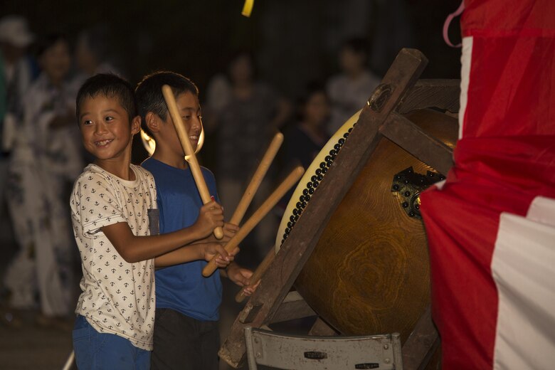 Local children play a drum during the Bon-Odori Yukata-Experience festival in the Yokoyama area of Iwakuni, Japan, Aug. 13, 2016. Locals and residents from Marine Corps Air Station Iwakuni danced to the singing of elders and the steady beat of drums. (U.S. Marine Corps photo by Lance Cpl. Joseph Abrego)