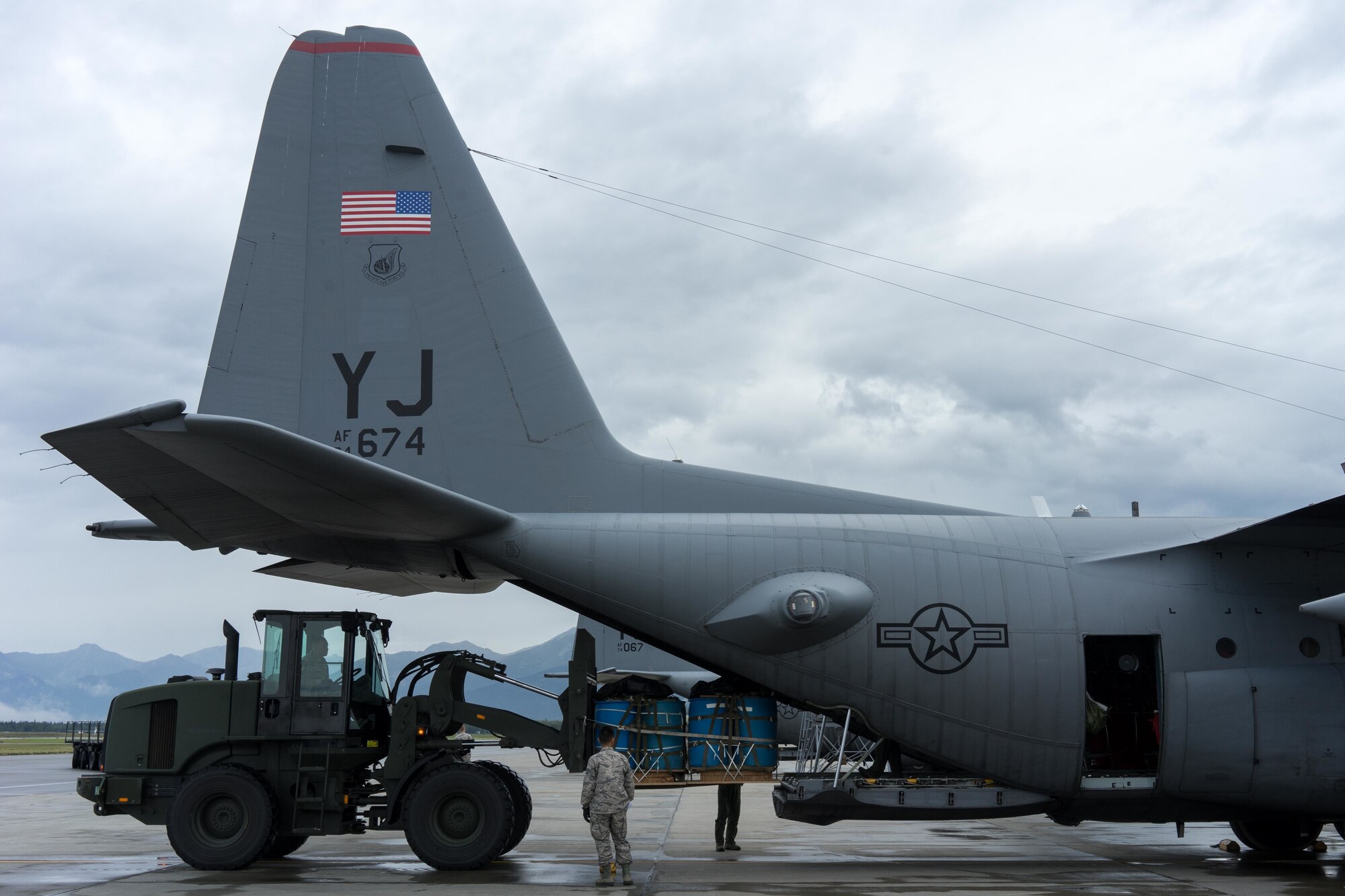 A 10k all-terrain forklift loads container delivery system bundles onto a Yokota Air Base C-130 Hercules during Red Flag Alaska on Joint Base Elmendorf-Richardson, Alaska, Aug. 12, 2016. Red Flag provides joint offensive counter-air, interdiction, close air support, and large force employment training in a simulated combat environment. (U.S. Air Force photo by Staff Sgt. Michael Smith/Released)