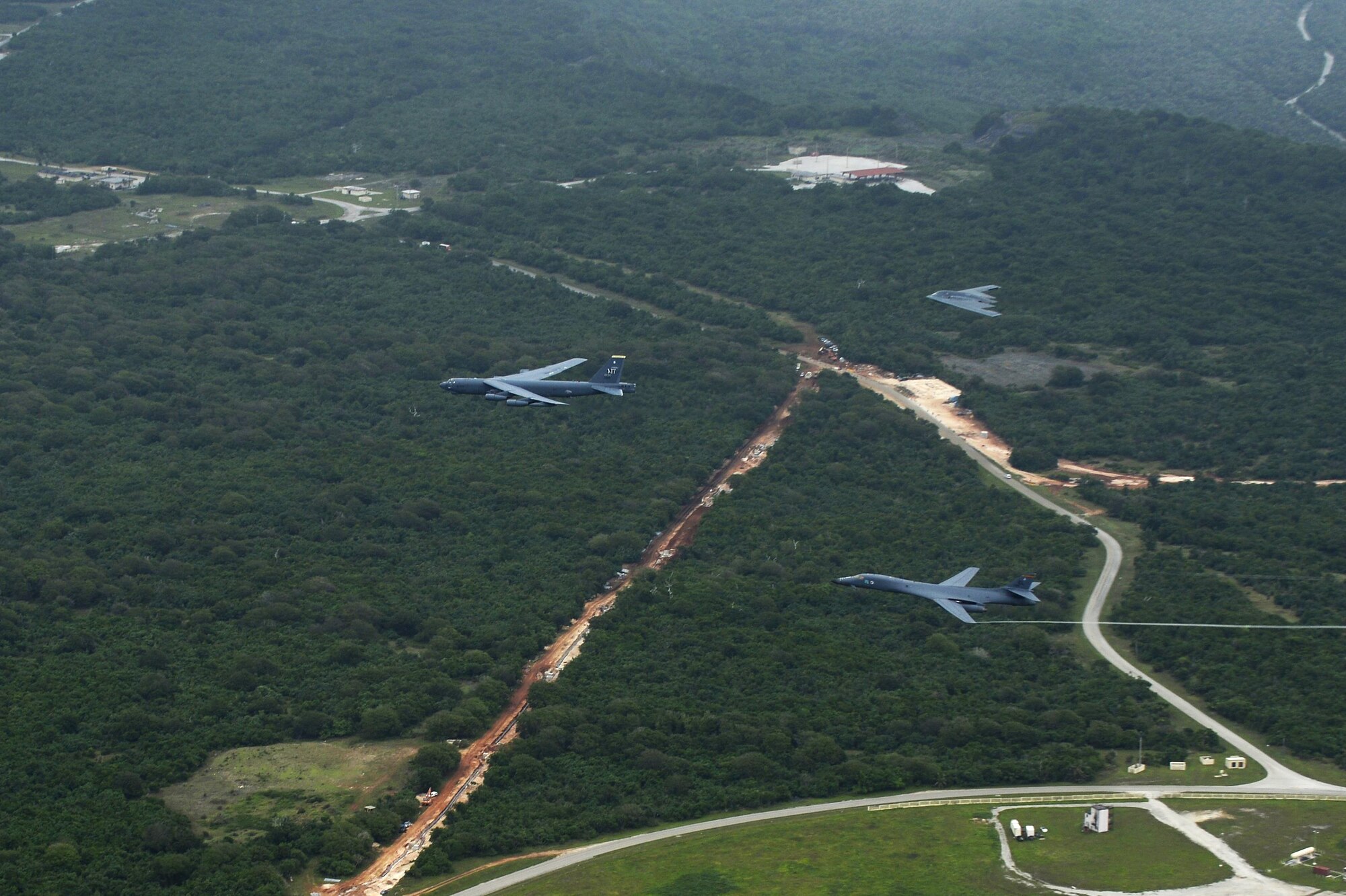 A U.S. Air Force B-52 Stratofortress, B-1 Lancer and B-2 Spirit fly over Guam after launching from Andersen Air Force Base, Guam, for an integrated bomber operation Aug.17, 2016. This mission marks the first time in history that all three of Air Force Global Strike Command's strategic bomber aircraft are simultaneously conducting integrated operations in the U.S. Pacific Command area of operations. As of Aug. 15, the B-1 Lancer will be temporarily deployed to Guam in support of U.S. Pacific Command's Continuous Bomber Presence mission. (U.S. Air Force photo by Staff Sgt. Sandra Welch)