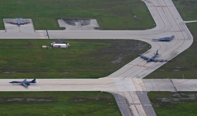 A U.S. Air Force B-52 Stratofortress, B-1 Lancer and B-2 Spirit taxi in preparation for an integrated bomber mission at Andersen Air Force Base, Guam, Aug.17, 2016. This mission marks the first time in history that all three of Air Force Global Strike Command's strategic bomber aircraft are simultaneously conducting integrated operations in the U.S. Pacific Command area of operations. As of Aug. 15, the B-1 Lancer will be temporarily deployed to Guam in support of U.S. Pacific Command's Continuous Bomber Presence mission. (U.S. Air Force photo by Senior Airman Joshua Smoot)