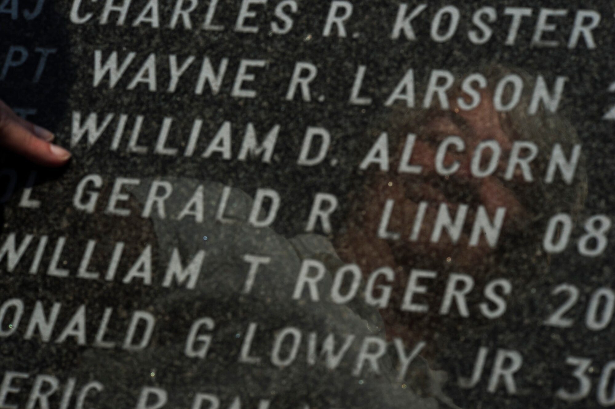 Bonnie Alcorn, sister of fallen U.S. Air Force Capt. William Alcorn, finds her brother’s name among the Airmen who have given the ultimate sacrifice while assigned at Spangdahlem Air Base, Germany, Aug. 15, 2016. Capt. Alcorn passed away on Mar. 23, 1981 during a training sortie in Germany. (U.S. Air Force photo by Staff Sgt. Jonathan Snyder)