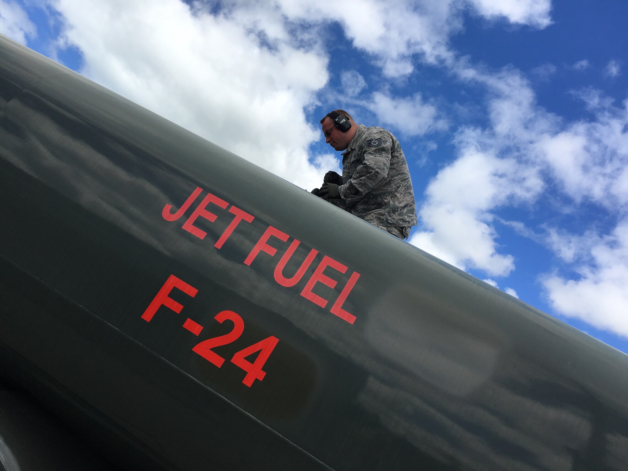 Tech. Sgt. Wesley Jones, fuels specialist in the 419th Logistics Readiness Squadron, inspects the manhole seal atop a fuel truck headed to the flightline at Joint Base Pearl Harbor-Hickam, Hawaii, Aug. 9. (U.S. Air Force photo/Bryan Magaña)