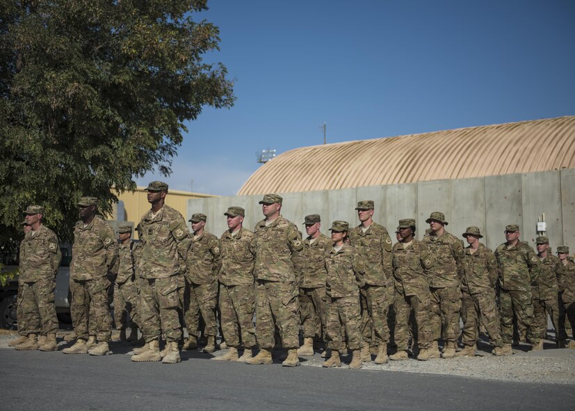 Bagram Airmen prepare to salute the flag during a retreat ceremony, Bagram Airfield, Afghanistan, Aug. 15, 2016. Members of the 455th Air Expeditionary Wing gather together monthly to pay respects to the flag. (U.S. Air Force photo by Senior Airman Justyn M. Freeman)