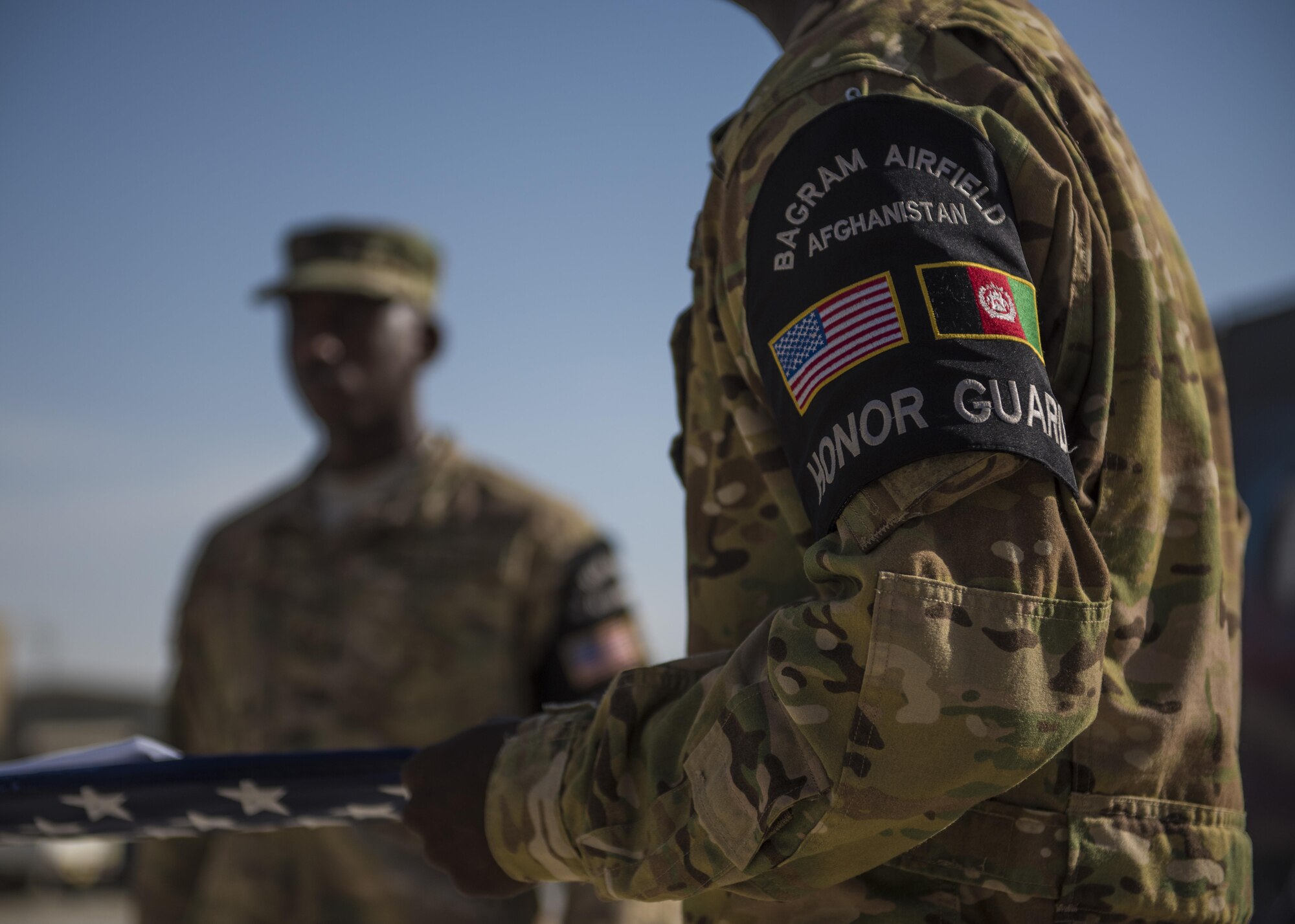 Members of the 455th Air Expeditionary Wing Honor Guard, fold a flag during a retreat ceremony, Bagram Airfield, Afghanistan, Aug. 15, 2016. Base honor guard is made up of volunteers who are dedicated to preserving Air Force heritage and promote and protect the Air Force image and standards. (U.S. Air Force photo by Senior Airman Justyn M. Freeman)