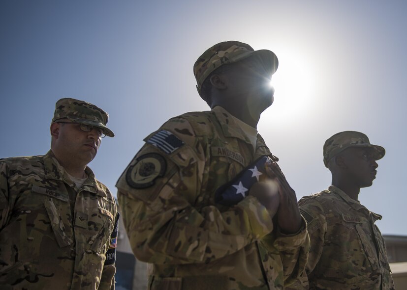Members of the 455th Air Expeditionary Wing Honor Guard, secure the flag during a retreat ceremony, Bagram Airfield, Afghanistan, Aug. 15, 2016. Base honor guard is made up of volunteers who are dedicated to preserving the Air Force heritage and promote and protect the Air Force image and standards. They perform military honors at official ceremonies such as retreat ceremonies, change of commands, and special observances. (U.S. Air Force photo by Senior Airman Justyn M. Freeman)