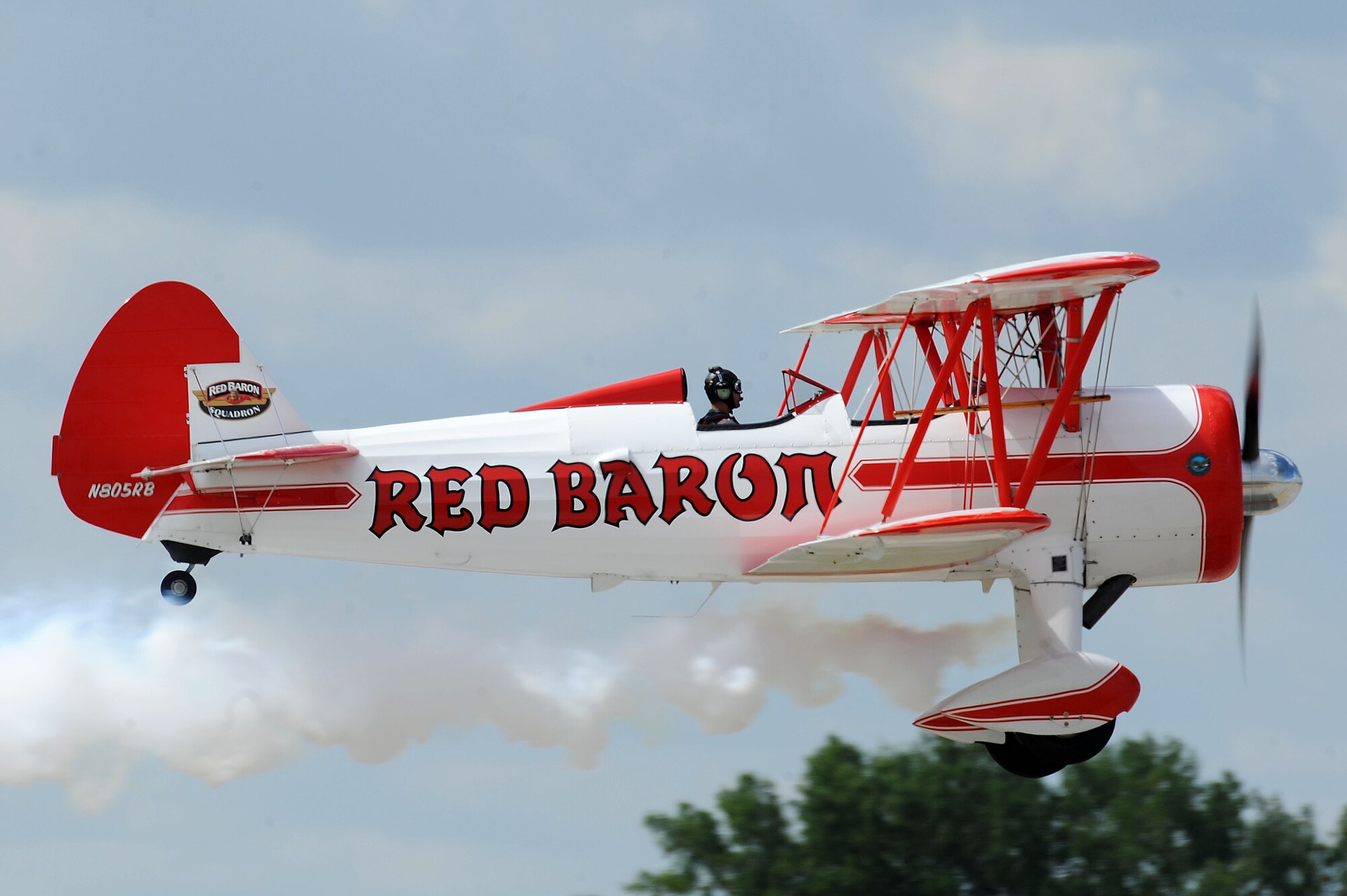 The Red Baron plane performed aerial stunts at the Northern Neighbors Day Air Show at Minot Air Force Base, N.D., Aug. 13, 2016.  The Red Baron is a WWII era Stearman bi-plane that was part of the Red Baron Squadron. (U.S. Air Force photo/Senior Airman Kristoffer Kaubisch)