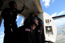 Member's of the U.S. Army Golden Knights look out over the Northern Neighbors Day Air Show at Minot Air Force Base, N.D., Aug. 13, 2016. The team performs parachute demonstrations at air shows, major league football and baseball games, and other special events, connecting the Army with the American people. (U.S. Air Force photo/Senior Airman Kristoffer Kaubisch)