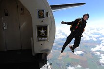 A member of the U.S. Army Golden Knights jumps out of a plane at the Northern Neighbors Day Air Show at Minot Air Force Base, N.D., Aug. 13, 2016. The team performs parachute demonstrations at air shows, major league football and baseball games, and other special events, connecting the Army with the American people. (U.S. Air Force photo/Senior Airman Kristoffer Kaubisch)