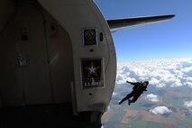 A member of the U.S. Army Golden Knights jumps out of a plane at the Northern Neighbors Day Air Show at Minot Air Force Base, N.D., Aug. 13, 2016. The team performs parachute demonstrations at air shows, major league football and baseball games, and other special events, connecting the Army with the American people. (U.S. Air Force photo/Senior Airman Kristoffer Kaubisch)