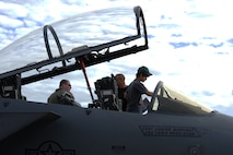 A young child observes an F-15 Strike Eagle static display at the Northern Neighbors Day Air Show at Minot Air Force Base, N.D., Aug. 13, 2016. Other static displays at the air show included a B-1 Bomber, UH-1N Huey, A-10 Warthog, C-130 Hercules and many more aircraft. (U.S. Air Force photo/Senior Airman Kristoffer Kaubisch)