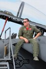 A Pilot sits on his F-15 Strike Eagle static display at the Northern Neighbors Day Air Show at Minot Air Force Base, N.D., Aug. 13, 2016. Other static displays at the air show included a B-1 Bomber, UH-1N Huey, A-10 Warthog, C-130 Hercules and many more aircraft. (U.S. Air Force photo/Senior Airman Kristoffer Kaubisch)