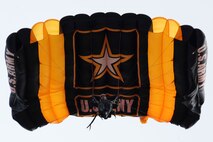 A member of the U.S. Army Golden Knights parachutes down to the ground at the Northern Neighbors Day Air Show at Minot Air Force Base, N.D., Aug. 13, 2016. The team performs parachute demonstrations at air shows, major league football and baseball games, and other special events, connecting the Army with the American people. (U.S. Air Force photo/Senior Airman Kristoffer Kaubisch)