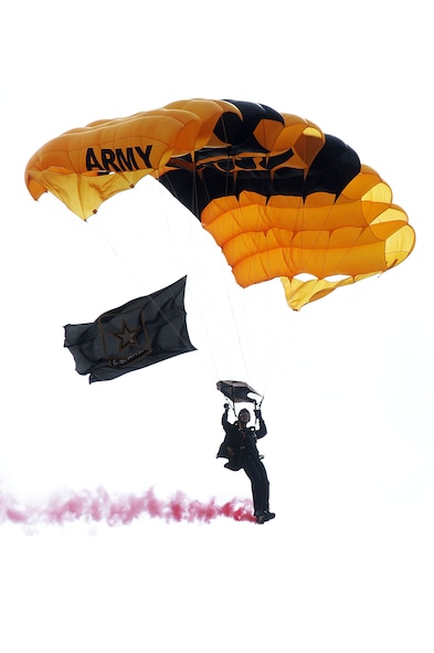A member of the U.S. Army Golden Knights parachutes down to the ground at the Northern Neighbors Day Air Show at Minot Air Force Base, N.D., Aug. 13, 2016. The team performs parachute demonstrations at air shows, major league football and baseball games, and other special events, connecting the Army with the American people. (U.S. Air Force photo/Senior Airman Kristoffer Kaubisch)