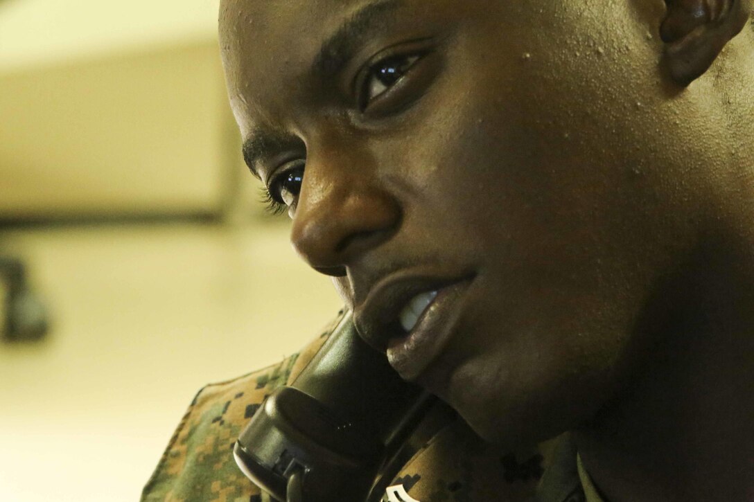 Marine Corps Cpl. Imani Golden, an embarkation specialist with III Marine Expeditionary Force Headquarters Group, arranges deployment flights in Okinawa, Japan, Aug. 3, 2016. Embarkation specialists handle all logistics coordination when Marines travel to different countries. Marine Corps photo by Lance Cpl. Nathaniel Cray