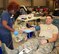 Capt. Christopher Kaighen, the commander of the 932nd Logistics Readiness Flight, slowly relaxes his fist as he smiles and enjoys the final process of donating blood with the American Red Cross, August 12, 2016 at the 932nd Airlift Wing building auditorium.  Kaighen had no hesitations to donate blood again, and said this was a time he was able to donate two bags worth. (U.S. Air Force photo by Maj. Stan Paregien)
