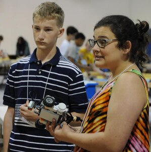 KING GEORGE. Va. – Madeline – a rising Spotsylvania High School freshman – mentors middle school students with another junior mentor at the 2016 Naval Surface Warfare Center Dahlgren Division (NSWCDD)-sponsored Navy science, technology, engineering, and mathematics (STEM) Summer Academy, held June 27 to July 1. Last year, while a student at the event, Madeline became inspired about STEM. This year, she was one of nine junior mentors who worked with teachers and senior mentors to advise the campers and brief parents during tours.