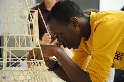 KING GEORGE. Va. – A middle school student builds a balsa wood tower he designed at the 2016 Naval Surface Warfare Center Dahlgren Division (NSWCDD)-sponsored Navy science, technology, engineering, and mathematics (STEM) Summer Academy, held June 27 to July 1. He was one of 96 middle school students who developed their teamwork and problem-solving skills in math and science while partnering with a teacher and an NSWCDD scientist or engineer.