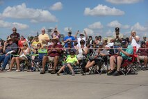 Spectators applaud during the Northern Neighbors Day Air Show at Minot Air Force Base, N.D., Aug. 13, 2016. Over 10,000 people from across the United States and Canada attended this air show. (U.S. Air Force photo/Airman 1st Class Jessica Weissman)