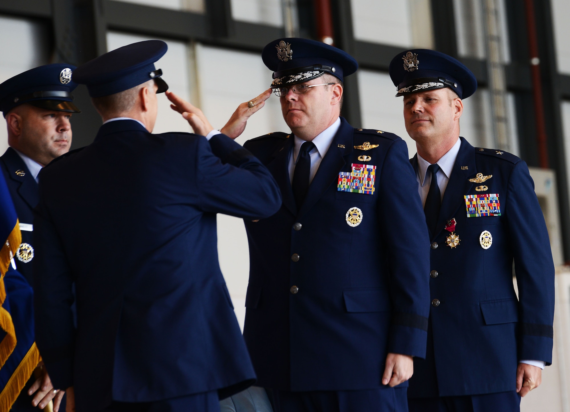 Brig. Gen. Richard G. Moore Jr., center, salutes Lt. Gen. Timothy M. Ray, as he takes command of the 86th Airlift Wing, Aug. 17, 2016, Ramstein Air Base, Germany. Moore will succeed Brig. Gen. Jon T. Thomas as the commander of approximately 9,000 Airmen. (U.S. Air Force photo/ Airman 1st Class Joshua Magbanua)