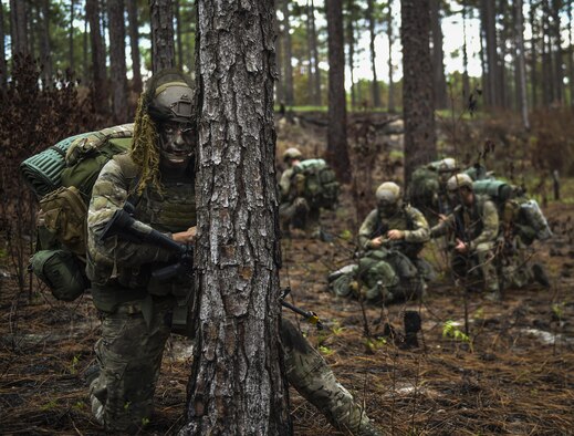 A Combat Control School student scans the woods as rear security for his unit during a tactics field training exercise at Camp Mackall, N.C., Aug. 3, 2016. The FTX is a culmination of tactics learned in the first year of the combat control team pipeline, which entails weapons handling, team leader procedures, patrol base operations, troop leading and small unit tactics under fire in one mission. (U.S. Air Force photo/Senior Airman Ryan Conroy)