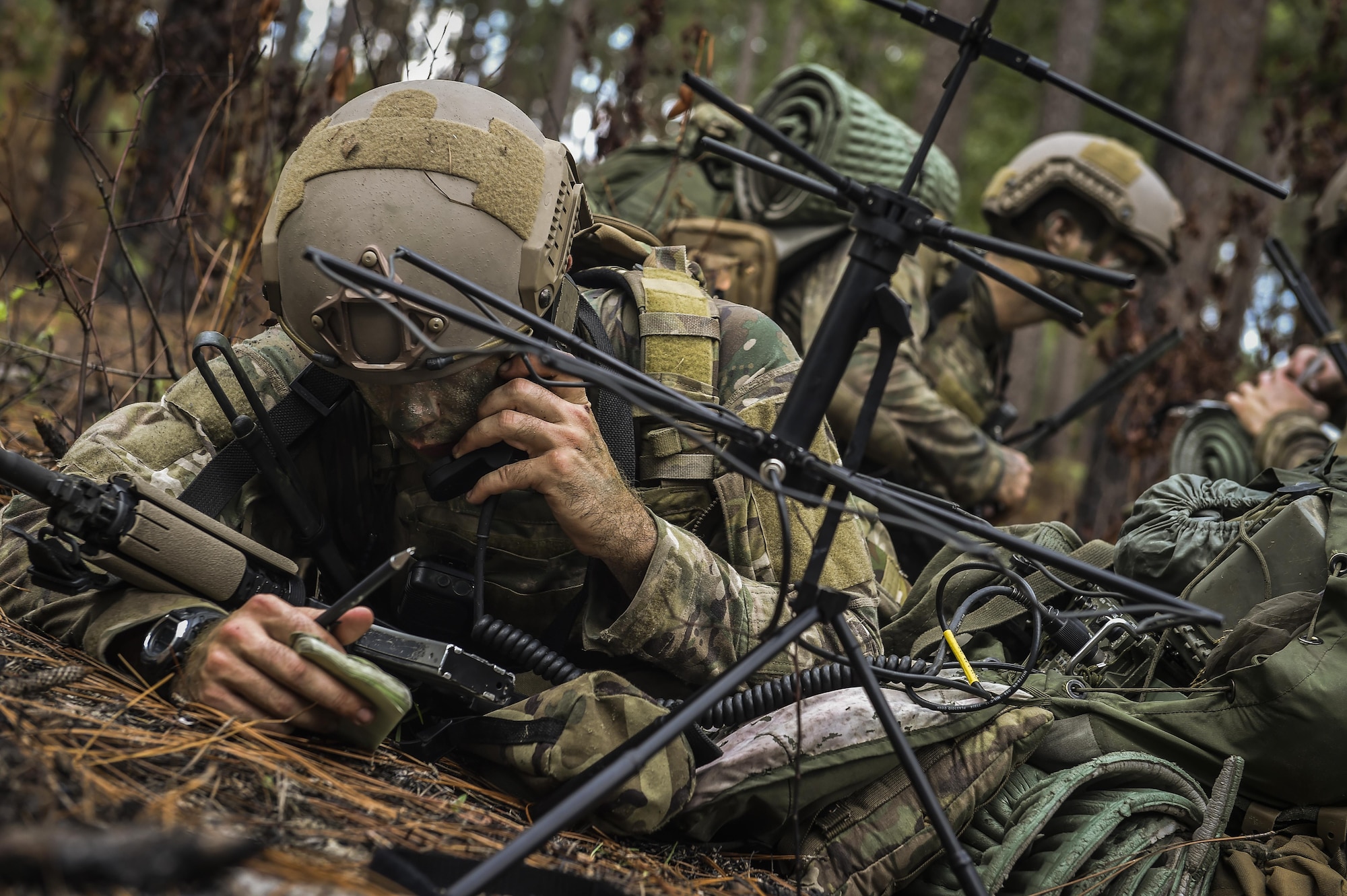 A 352nd Battlefield Airmen Training Squadron Combat Control School student radios to a simulated aircraft during a tactics field training exercise at Camp Mackall, N.C., Aug. 3, 2016. The 352nd BATS, or Combat Control School, is the home of a 13-week course that provides initial CCT qualifications. The training includes, small unit tactics, land navigation, communications, assault zones, physical training demolitions, fire support and field operations including parachuting. At the completion of this course, each graduate is awarded the three-skill level, scarlet beret and CCT flash. (U.S. Air Force photo by Senior Airman Ryan Conroy)