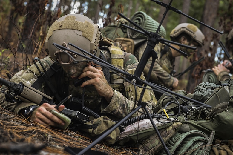 A 352nd Battlefield Airmen Training Squadron Combat Control School student radios to a simulated aircraft during a tactics field training exercise at Camp Mackall, N.C., Aug. 3, 2016. The 352nd BATS, or Combat Control School, is the home of a 13-week course that provides initial CCT qualifications. The training includes, small unit tactics, land navigation, communications, assault zones, physical training demolitions, fire support and field operations including parachuting. At the completion of this course, each graduate is awarded the three-skill level, scarlet beret and CCT flash. (U.S. Air Force photo by Senior Airman Ryan Conroy)