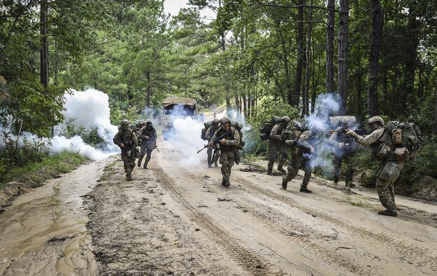 Combat Control School students assigned to the 352nd Battlefield Airmen Training Squadron are ambushed during a tactics field training exercise at Camp Mackall, N.C., Aug. 3, 2016. The FTX is a culmination of tactics learned in the first year of the CCT pipeline; which entails weapons handling, team leader procedures, patrol base operations, troop leading and small unit tactics under fire in one mission. (U.S. Air Force photo by Senior Airman Ryan Conroy)