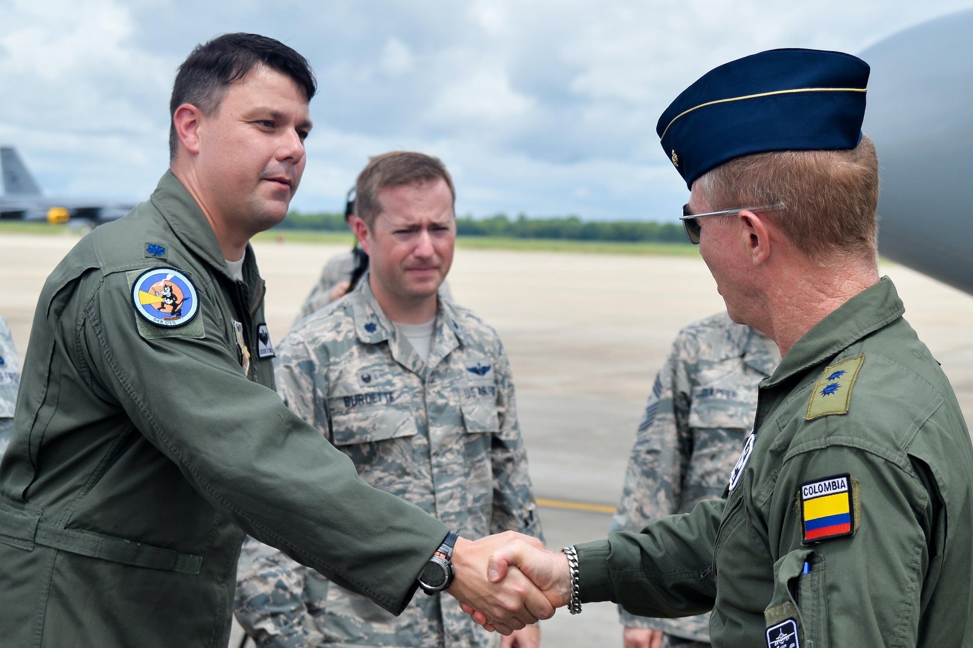 Lt. Col. Jason Attaway, 548th Combat Training Squadron, Detachment 1 commander, greets Colombian Air Force Brig. Gen. Rodrigo Alejandro Valencia Guevara upon his arrival to Barksdale Air Force Base, La., Aug. 13, 2016. The Colombians are participating in Exercise Green Flag East, which is administered by the 548th CTS detachment. (U.S. Air Force photo/Senior Airman Mozer O. Da Cunha)