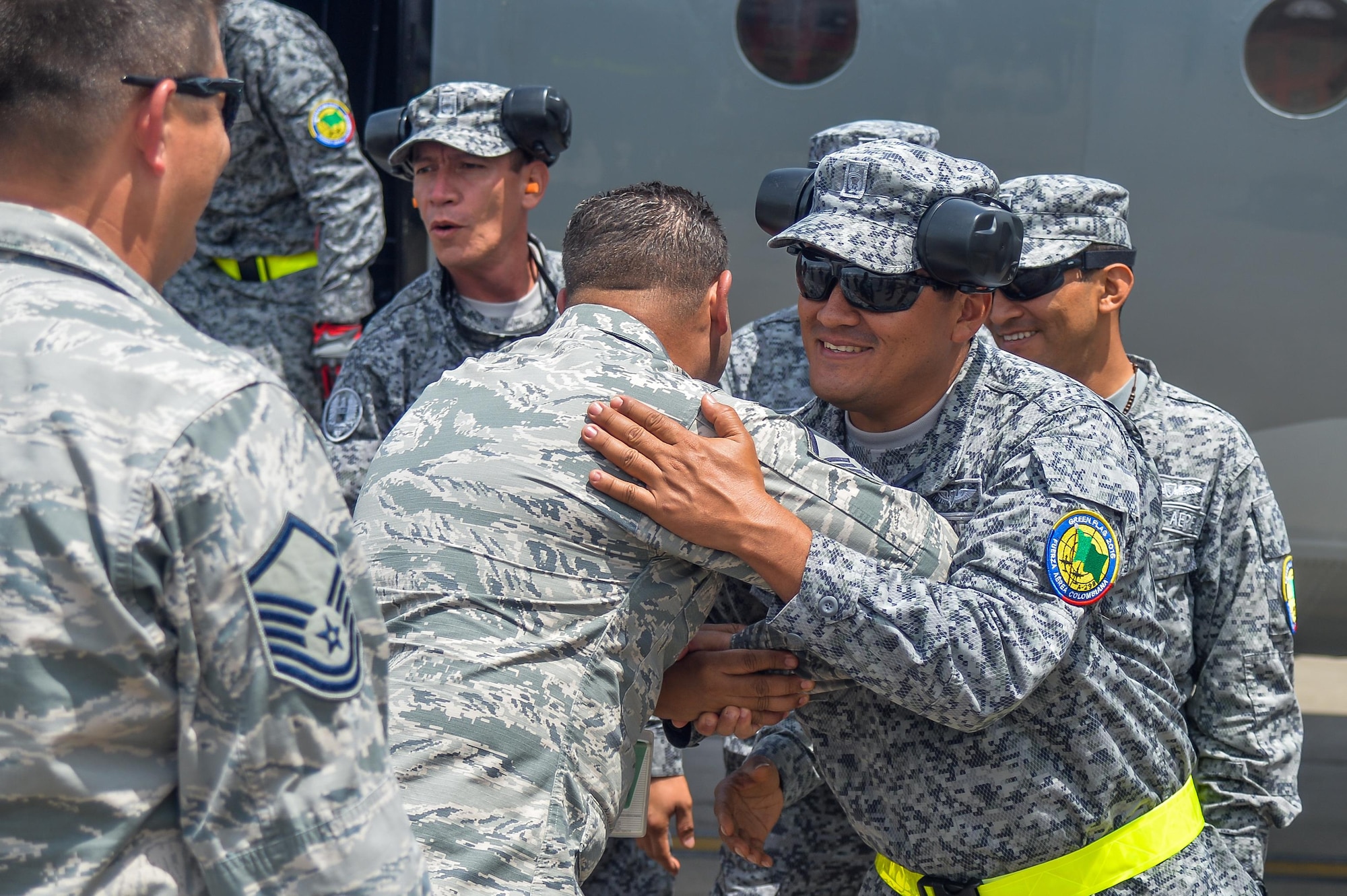 Colombian and U.S. Air Force Airmen greet each other after the Colombians arrived to Barksdale Air Force Base, La., Aug. 13, 2016. The Colombian Airmen, along with four A-29B Super Tucano aircraft, are at Barksdale to participate in Exercise Green Flag East Aug. 15-29. (U.S. Air Force photo/Senior Airman Mozer O. Da Cunha)