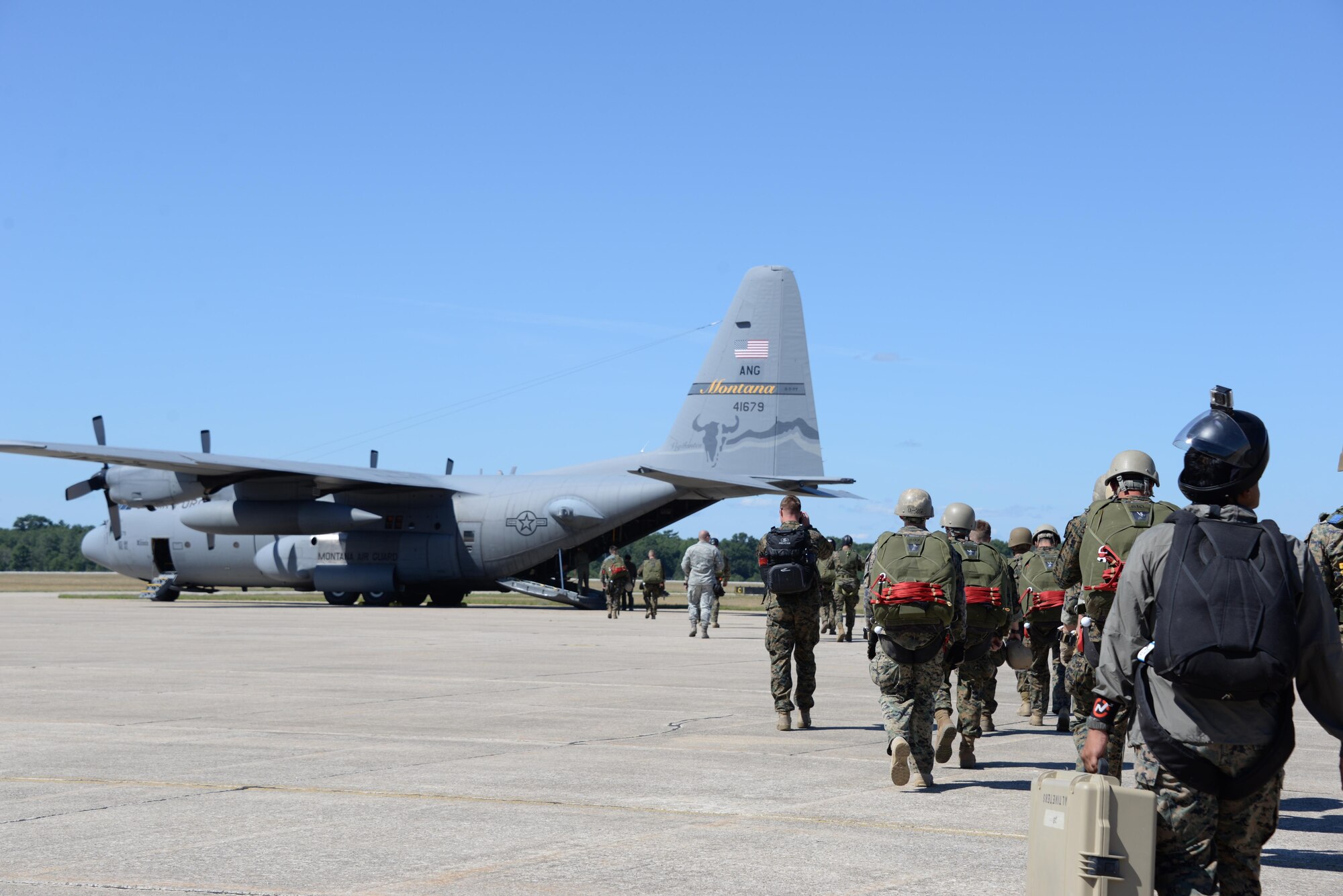 U.S. Marines from the 4th Reconnaissance Element out of Fort Sam Houston, Texas, load on to a C-130 Hercules from the Illinois Air National Guard at Grayling Army Airfield, Michigan, as part of Exercise Northern Strike, Aug. 8, 2016. The exercise brought together multiple branches, states and countries. (U.S. Air Force photo by Senior Airman Amber Carter)