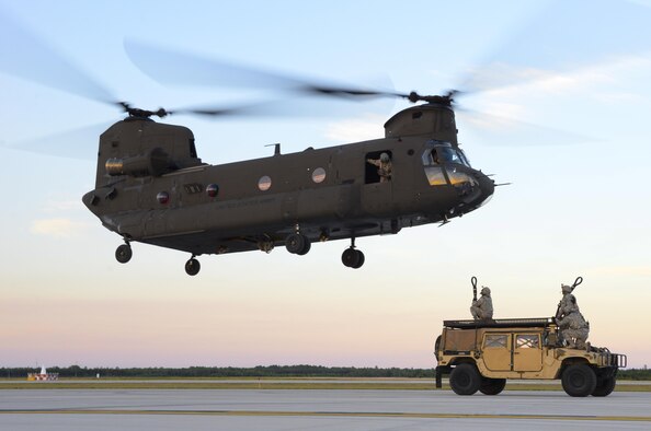 Airmen from the 821st Contingency Response Group out of Travis Air Force Base, Calif., get positioned to attach a Humvee to a U.S. Army CH-47 Chinook at Alpena Combat Readiness Training Center, Mich., during exercise Northern Strike, Aug. 9, 2016. Northern Strike is a large-scale exercise coordinated by the Michigan Army National Guard and features Army, Marine Corps and Air Force working together for total force integration. (U.S. Air Force photo/Senior Airman Amber Carter)