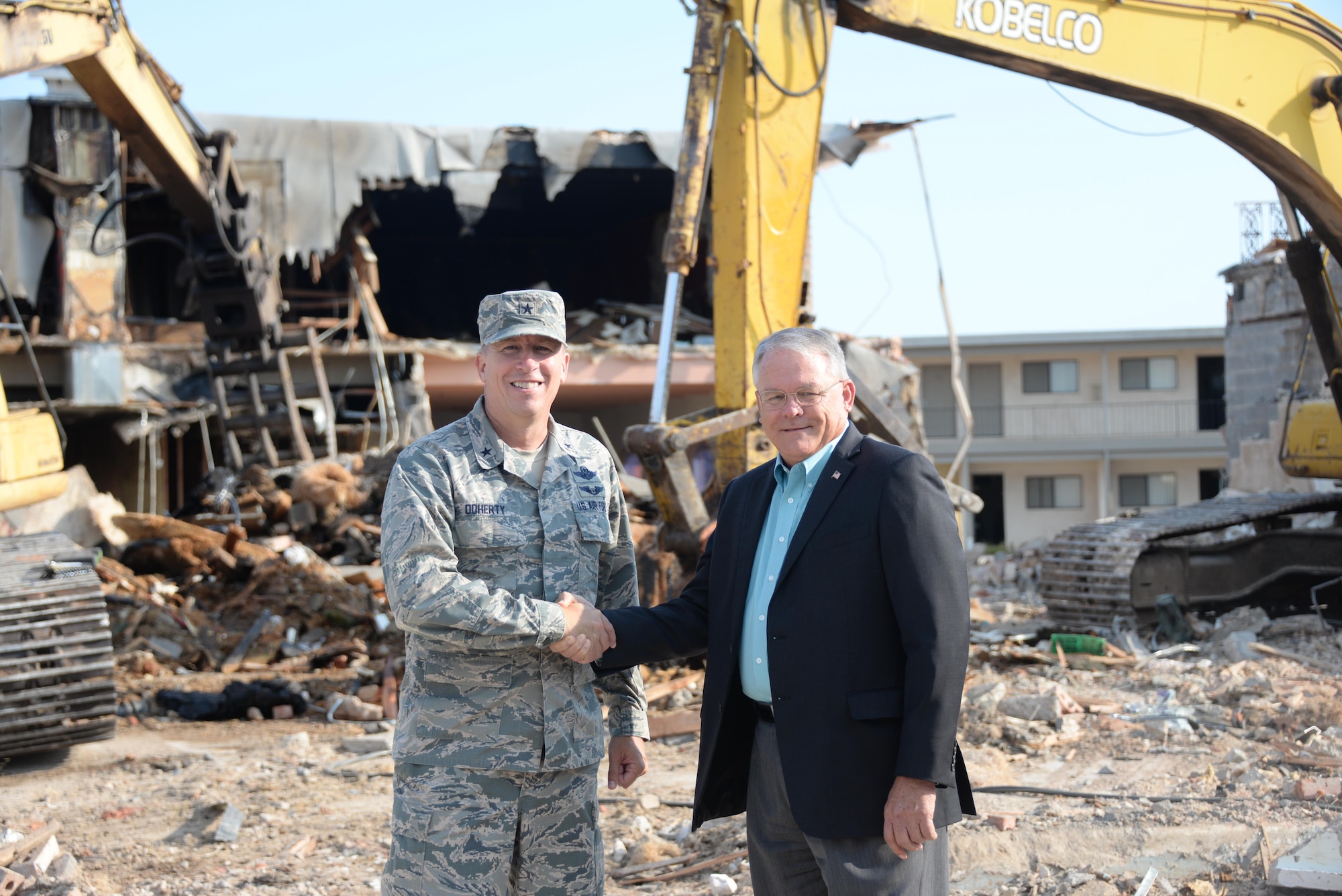 82nd Training Wing Commander Brig. Gen. Patrick Doherty shakes hands with Wichita Falls Mayor Glenn Barham outside Sheppard's Main Gate. Demolition is ongoing as part of a $3.5 million project by the city to improve the area.