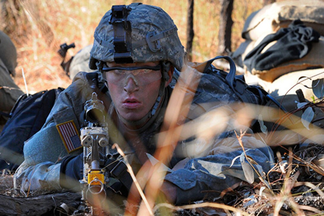 Army Pvt. Michael Collins scans the area for enemy movement during Talisman Sabre 15 at the Shoalwater Bay Training Area, Australia, July 18, 2015. Army photo by Sgt. Sinthia Rosario