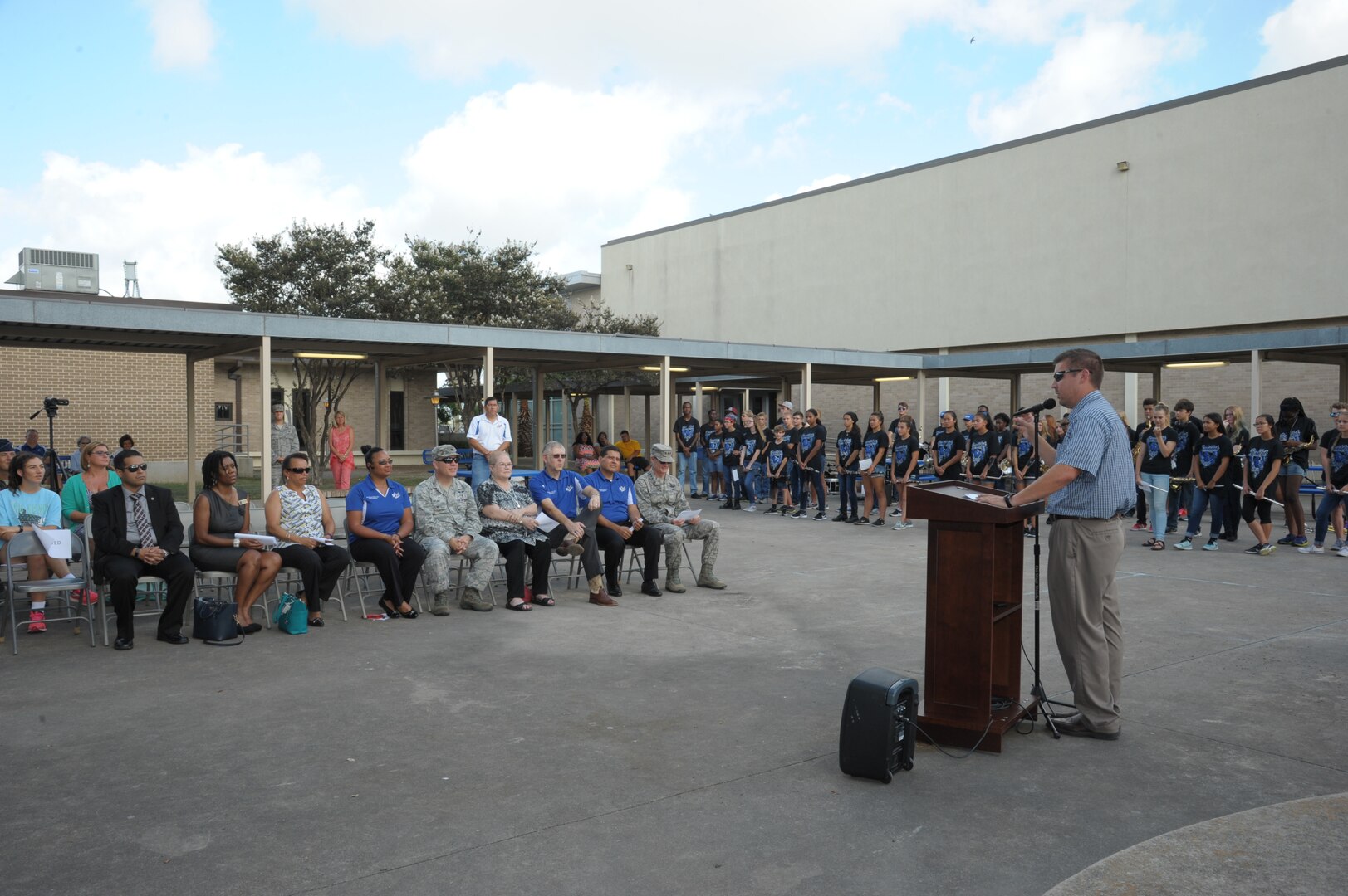 Lance Johnson, Randolph Field Independent School District superintendent, addresses the audience during the ribbon-cutting ceremony for the new high school building Aug. 10 at Joint Base San Antonio-Randolph.The $15 million project includes the construction of a new cafeteria and gymnasium that will be housed together in a separate 33,000-square-foot building, with an expected completion date of March 2017.