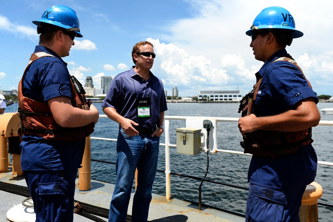 Herb Chambers IV, center, president and CEO of EVX Midstream Partners LLC, interacts with Coast Guardsmen aboard Coast Guard Cutter Joshua Appleby at Coast Guard Sector St. Petersburg, Fla., Aug. 16, 2016, during the Joint Civilian Orientation Conference. DoD photo by Marine Sgt. Drew Tech