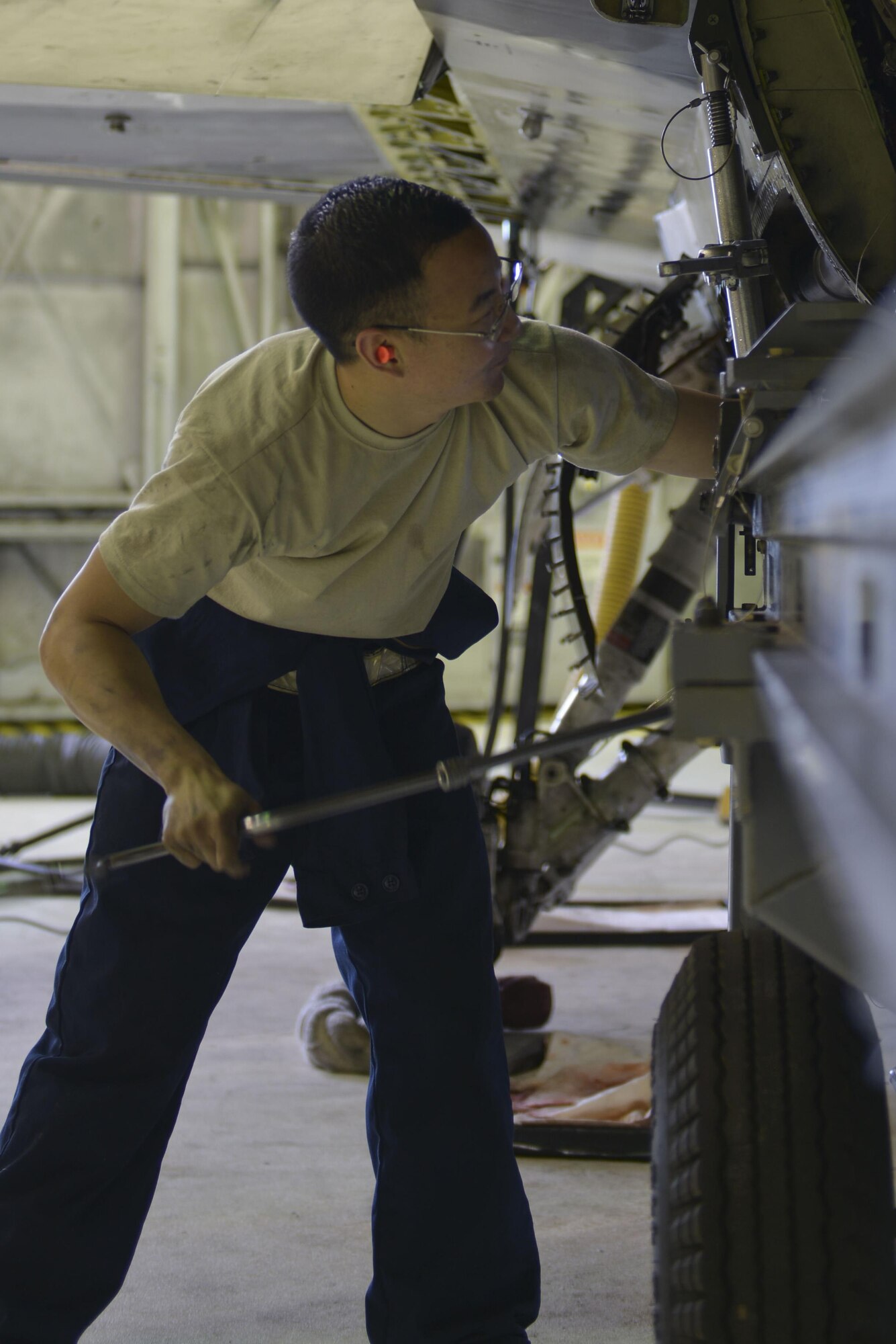 U.S. Air Force Staff Sgt. Jeffrey Jin, a 354th Maintenance Squadron aerospace propulsion craftsman, helps prepare an F-16 Fighting Falcon aircraft for the engine to be removed Aug. 12, 2016, during RED FLAG-Alaska 16-3, in the phase shop at Eielson Air Force Base, Alaska.This engine is being pulled so that the Joint Service Electrical Combat Systems Tester can be replaced. (U.S. Air Force photo by Airman Isaac Johnson)