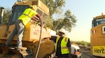 William Daniels (right), 502nd Logistics Readiness Squadron’s Fuels Management Flight fuels distribution worker, ensures fuel is flowing into a tractor from his refueling vehicle Sept. 30, 2015, at Joint Base San Antonio-Lackland. On a typical day he can pump 50,000 to 100,000 gallons.  