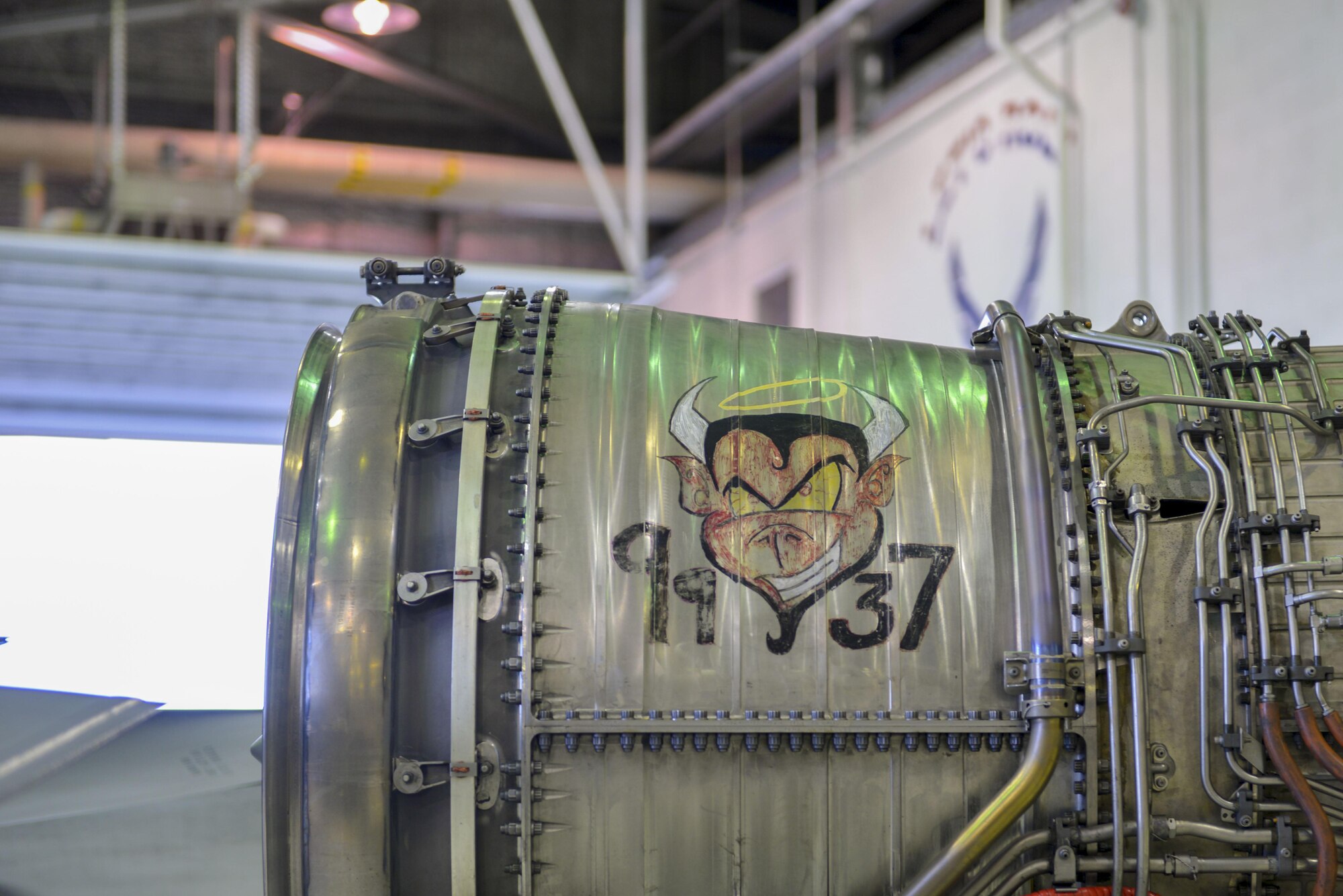 The removal of an engine from a U.S. Air Force F-16 Fighting Falcon aircraft Aug. 12, 2016, during RED FLAG-Alaska 16-3, in the Eielson Air Force Base, Alaska, phase shop displays unique engine art during RED FLAG-Alaska 16-3. The F-16 Fighting Falcon’s top speed is more than 1,500 miles per hour. (U.S. Air Force photo by Airman Isaac Johnson)