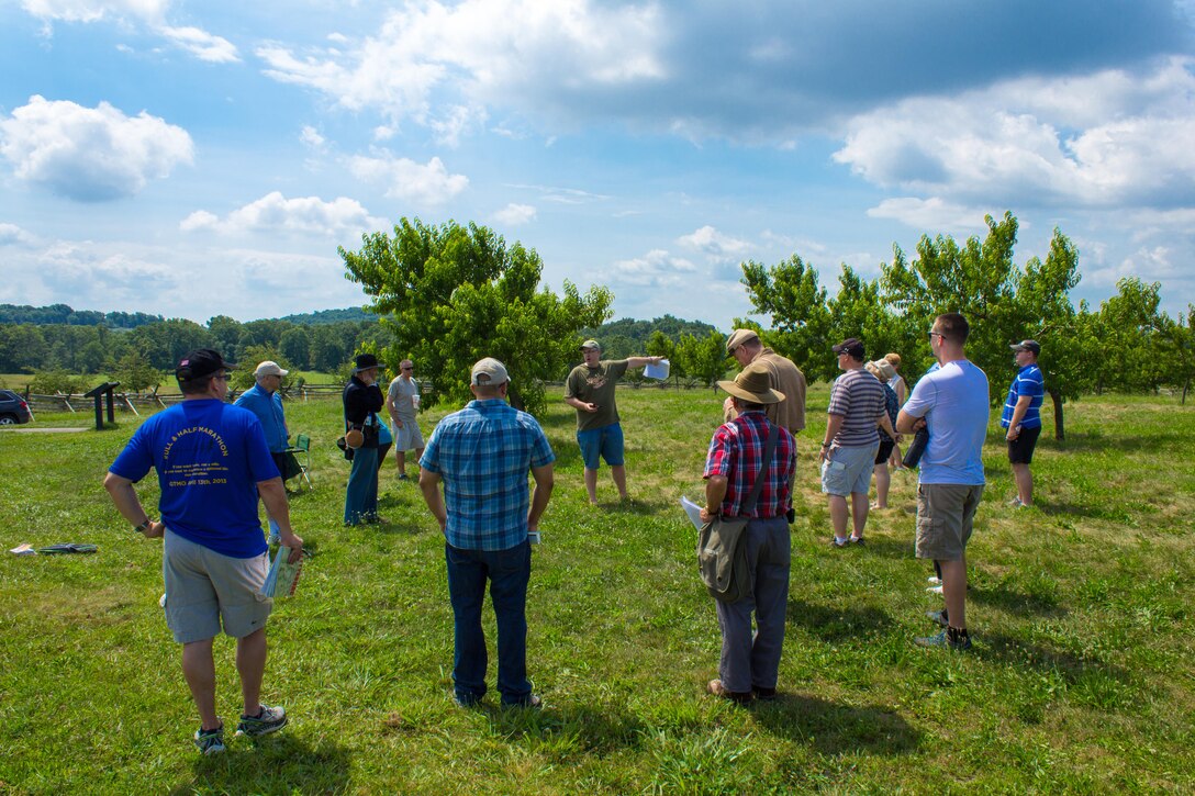 DIA Analyst Greg Elder details troop movements at the Peach Orchard on Gettysburg National Battlefield. 