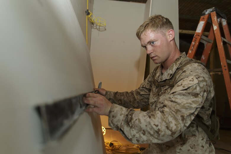 Cpl.  Thomas A. Trinosky Jr., a combat engineer with Engineer Services Company, Combat Logistics Battalion 25, scribes a line on a slab of drywall during Innovative Readiness Training Dry Tortugas at Dry Tortugas National Park, Fla., Aug. 15, 2016. IRT Dry Tortugas is an Air Force Reserve-led project to provide construction services at the request of the National Park Service. During this year’s iteration, the Marines and Airmen worked together to renovate the crew quarters of Fort Jefferson in Dry Tortugas. (U.S. Marine Corps photo by Sgt. Ian Leones/Released)