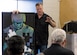 Retired Master Sgt. Cody Vance speaks about his vision behind creating his Post-traumatic Stress Disorder art piece during an Open the Door Veterans’ Project event. The Post-traumatic Stress Disorder art has been reproduced and seen all over the world and is currently part of the Pentagon’s Air Force Art Program. (Courtesy photo)