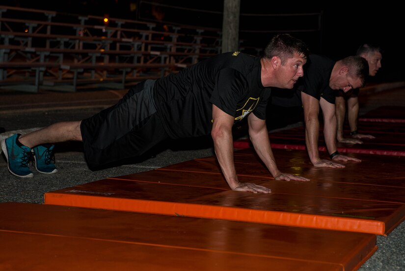 Patrick J. Murphy, Under Secretary  of the Army, performs push-ups during physical training with F-Company, 1-222 Aviation Regiment at Fort Eustis, Va., Aug. 16, 2016. During PT, the unit performs variations of calisthenics for push-ups and pull-ups. (U.S. Air Force photo by Airman 1st Class Derek Seifert)