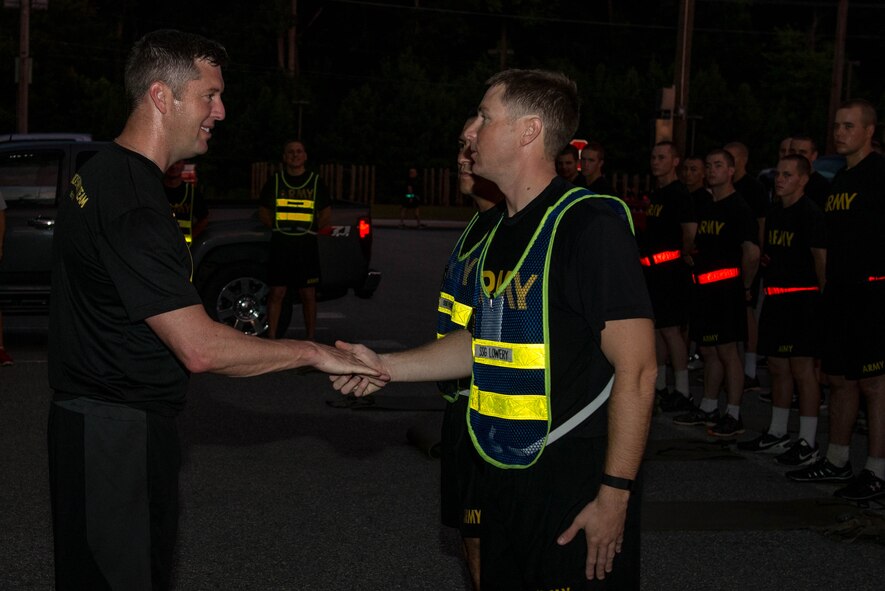 Patrick J. Murphy, Under Secretary of the Army, presents a coin to the cadre of F-Company, 1-222 Aviation Regiment at Fort Eustis, Va., Aug. 16, 2016. While serving in Iraq, Murphy oversaw the justice system for the 1.5 million Iraqis in south central Baghdad and prosecuted two high-level terrorists in Iraq’s highest courts. (U.S. Air Force photo by Airman 1st Class Derek Seifert)