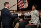 Patrick J. Murphy, Under Secretary of the Army, coins a Soldier for asking the first question during a town hall at Fort Eustis, Va., Aug. 16, 2016. The question referred to changes the Army could face with the upcoming presidential election. (U.S. Air Force photo by Airman 1st Class Derek Seifert)